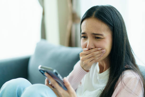 istock Stressed - unhappy Asian young woman at home. 1724426968