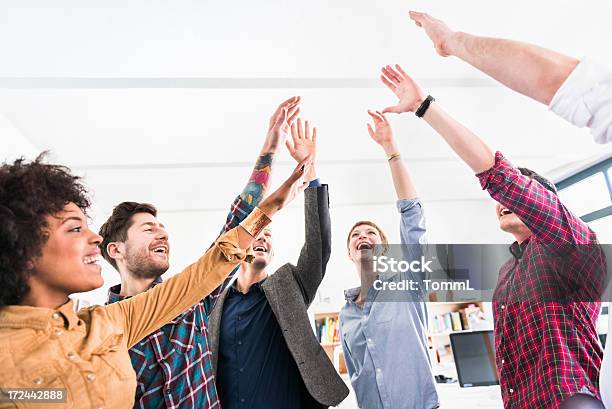 Young Business People Showing Team Spirit Stock Photo - Download Image Now - Above, People, Adult