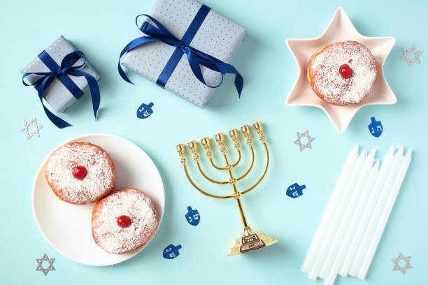 istock Happy Hanukkah elements on pastel blue background. Flat lay, top view. 1724429160