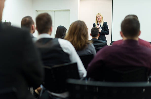 istock Young businesswoman with microphone 172443271