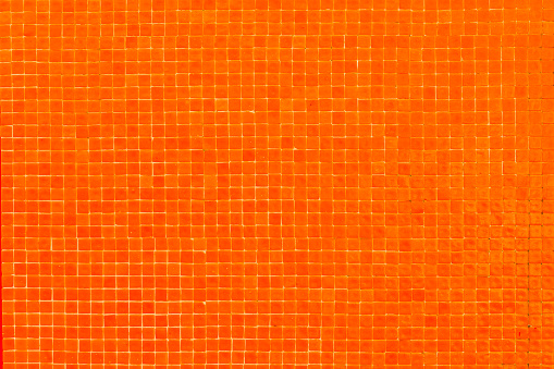 Small orange tiles background, new gresite material full frame view.