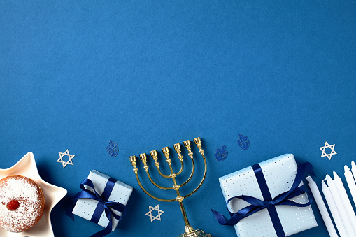 Hanukkah Background with Defocused Menorah and Dreidel