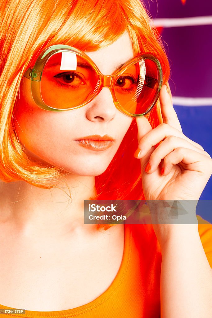 Ventilador de laranja com óculos de sol - Foto de stock de 20 Anos royalty-free