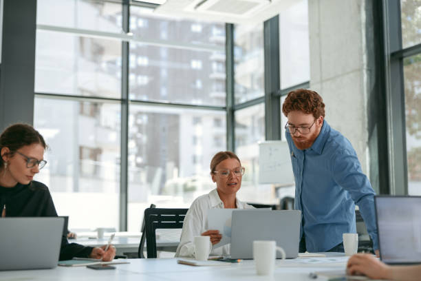 istock Business colleagues working together on project in office while use laptop. Teamwork concept 1724438789
