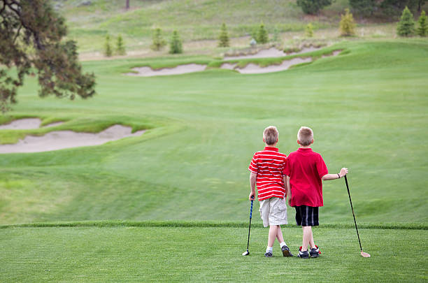 golfe junior - standing family golf loving - fotografias e filmes do acervo