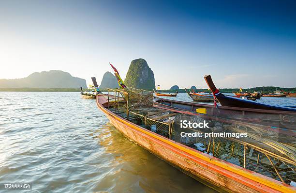 Long Tail Boat Sits In The Beautiful Beach Stock Photo - Download Image Now - Agriculture, Andaman Sea, Asia