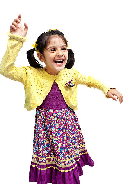 陽気で楽しいダンスの女の子のリトルインド白で分離 - child little girls shy standing ストックフォトと画像