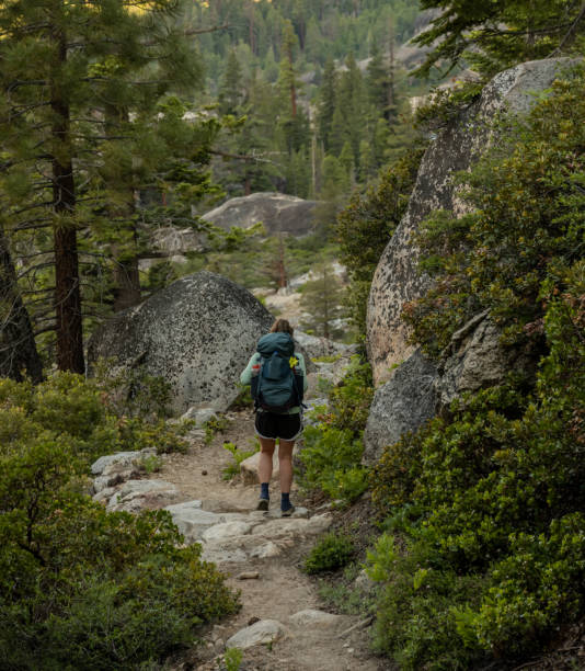 istock Woman Backpacks on Trail Through Yosemite WIlderness 1724454757
