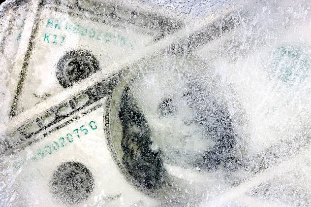 冷凍ドル - frozen currency finance ice ストックフォトと画像