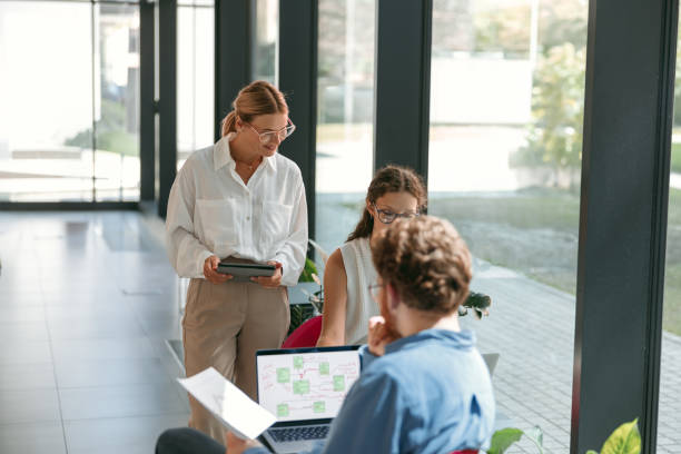 istock Businesspeople working together in modern coworking space. Teamwork concept 1724459532