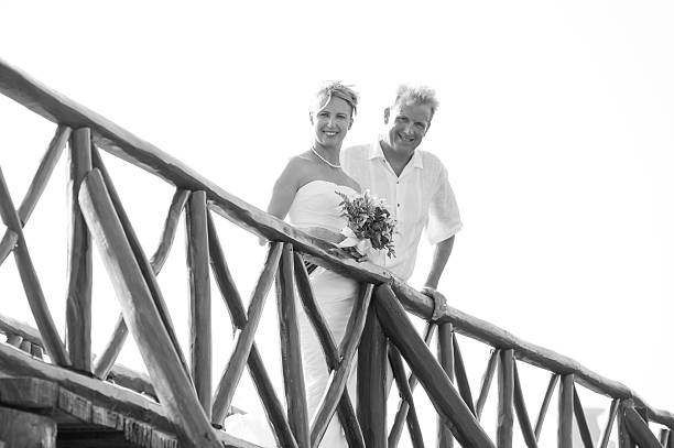 Bride and Groom on Bridge Looking Down