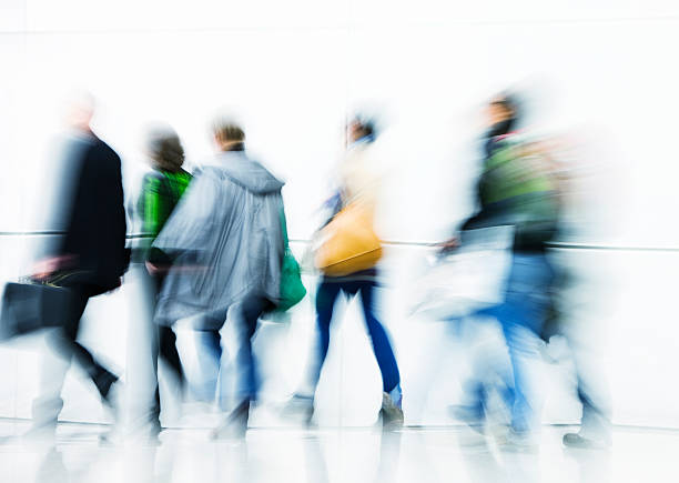 istock Group of Motion Blurred Walking People on White Background 172446400