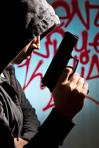 istock Man in hood with revolver 172446917