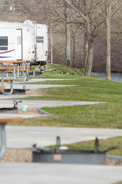 istock RV in campground by creek 172447630