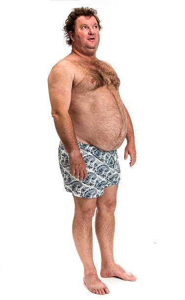 Unhealthy Lifestyle Shirtless fat man on white background fat guy no shirt stock pictures, royalty-free photos & images
