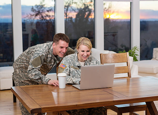 istock Military couple looking at a laptop 172448070