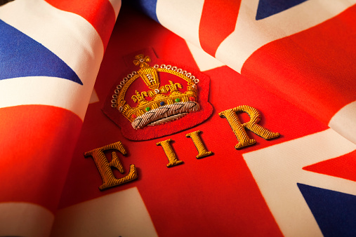 Flag of the British Virgin Islands on a textured background. Concept collage.