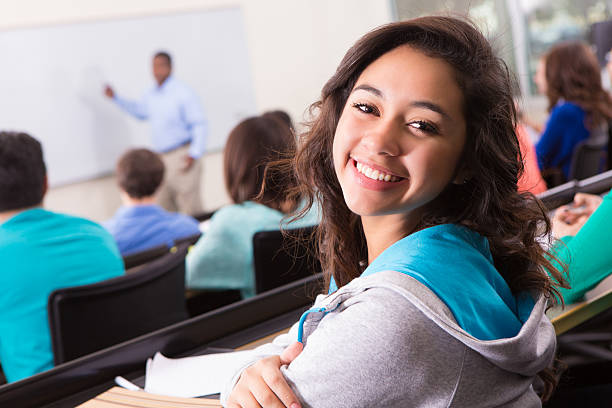 istock College Student Wearing Hoody Looking Back During Lecture 172449152