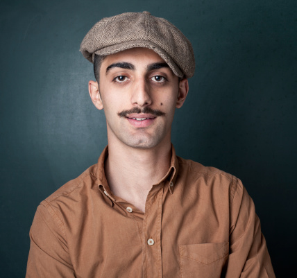 Full frame portrait of man with newsboy cap