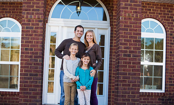 istock Family standing outside front door 172449425