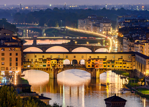 Ponte Vecchio bridge over Arno river at sunset, Florence, Italy