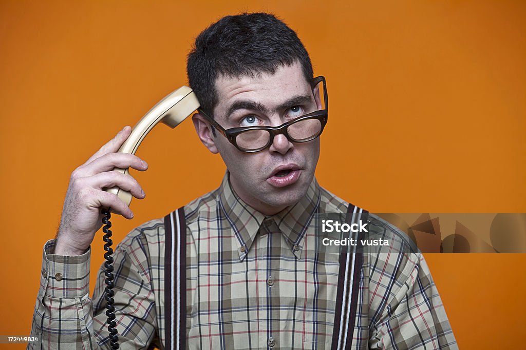 Confuso nerd no telefone - Foto de stock de Laranja - Descrição de Cor royalty-free