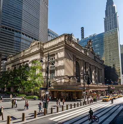 New York City, USA - April 7, 2018: Aerial view of urban buildings and traffic with bus in NYC Herald Square Midtown with red Macy's store, Verizon and HM