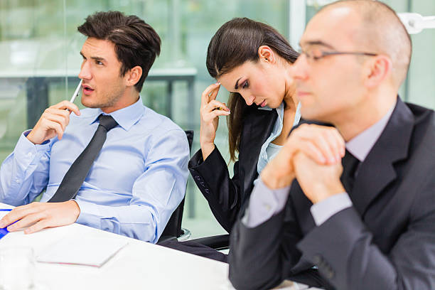 istock Bored business people at the office 172450420