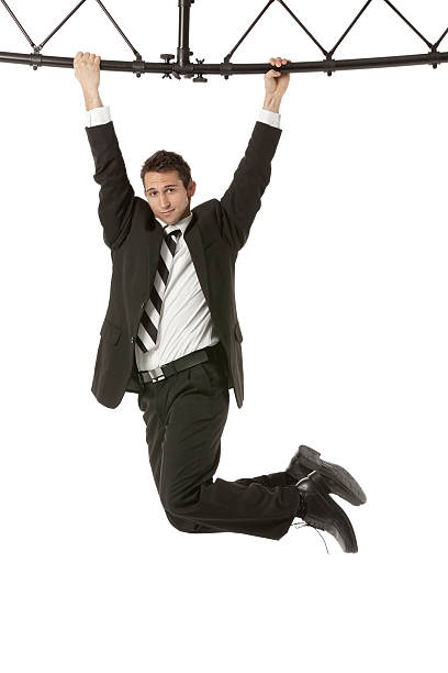 istock Businessman hanging from a metal structure 172450589