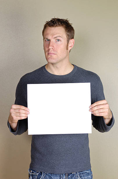 istock Signs - Handsome man holding blank white sign. 172450673