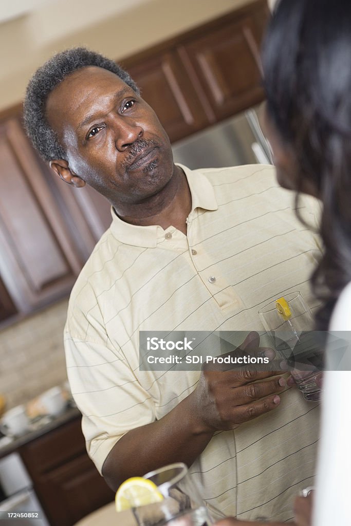 Senior African American couple having discussion in kitchen Active Seniors Stock Photo