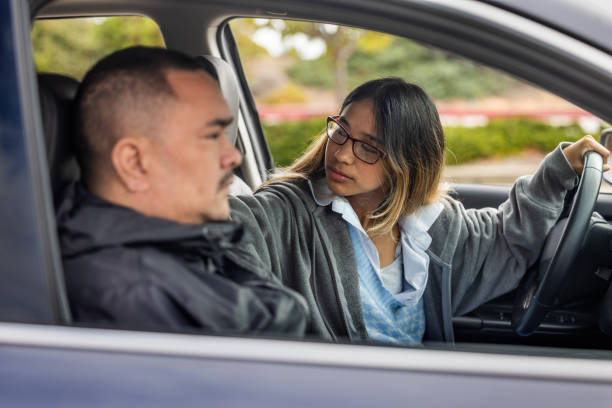 istock Father Teaching Daughter to Drive 1724513880