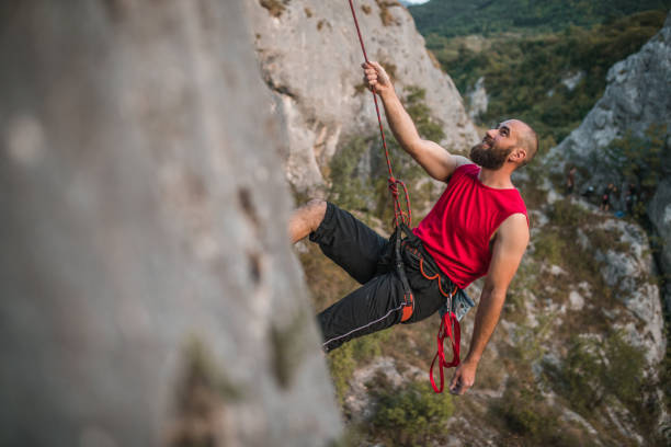 istock A male climber climbs a mountain during the day 1724529175