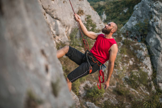 istock A male climber climbs a mountain during the day on extreme terrain 1724530752
