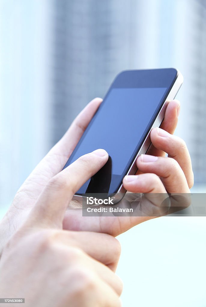 Uomini d'affari utilizzando Smart Phone - Foto stock royalty-free di Affari