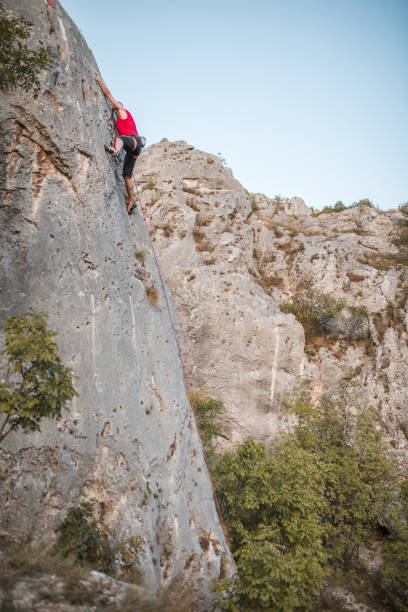 istock A male climber overcomes extremely steep terrain by climbing a mountain 1724532402