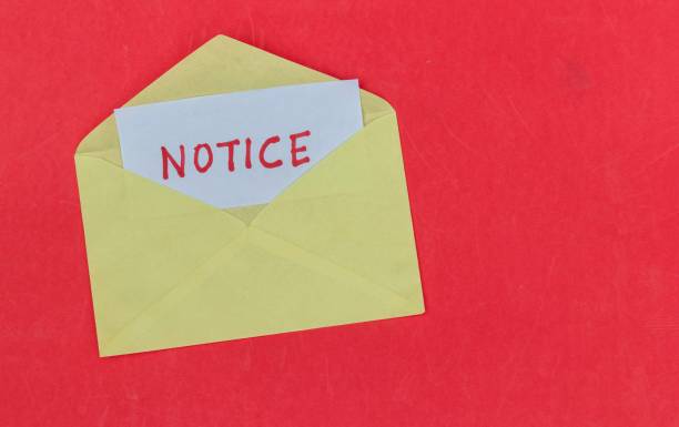 istock Notice Word in Envelope Isolated on Red Background with Copy Space 1724536188