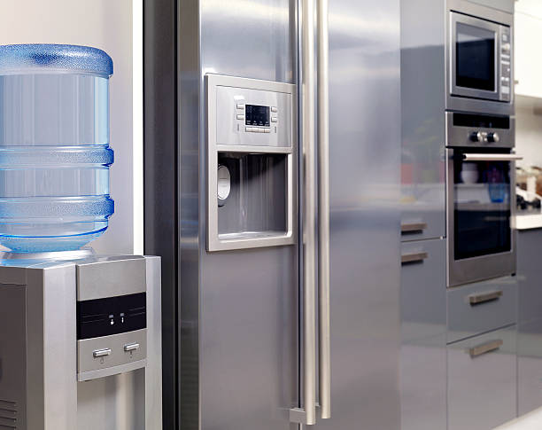 Stainless appliances and water dispenser of a modern kitchen