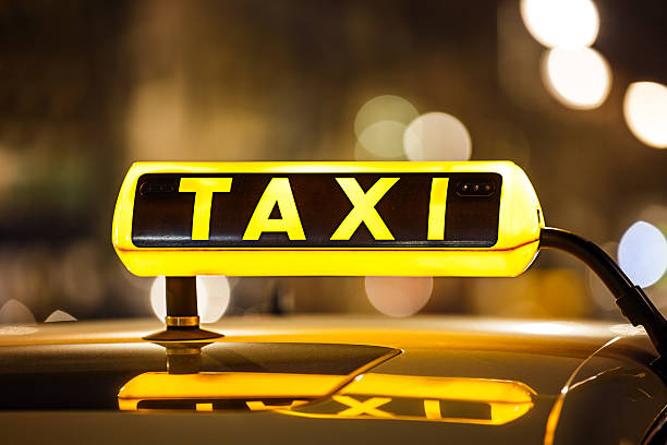 Illuminated Taxi sign stock photo