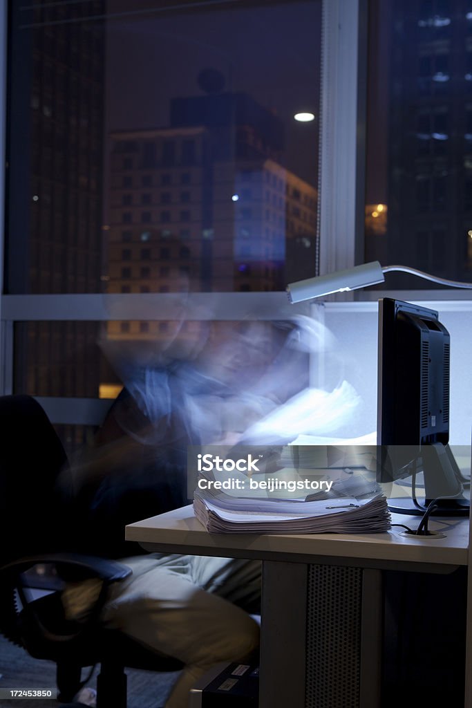 working over time businessman working late at night.Busy work in blur motion. Adult Stock Photo