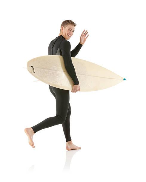 istock Surfer with surfboard and waving hands 172453862