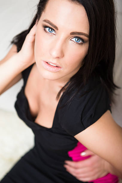 istock Beautiful woman sitting on floor 172454089