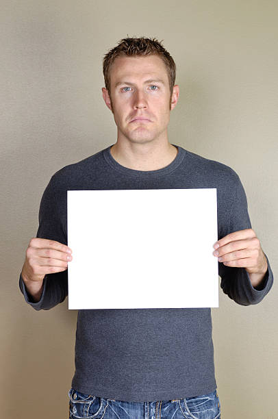 istock Signs - Handsome man holding blank white sign. 172454548