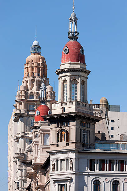 Parish of Blessed Sacrament in Tandil. Building facade has three towers and domes each with their cross. see the statue of the virgin in front of the bell tower