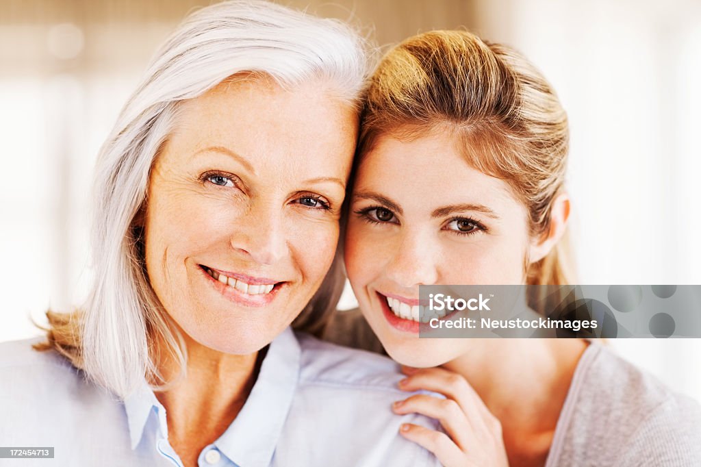 Happy Grandmother With Granddaughter Portrait of happy young woman with grandmother. Horizontal shot. 60-69 Years Stock Photo
