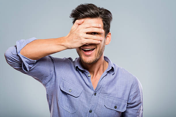 istock Young man covering his eyes 172454831