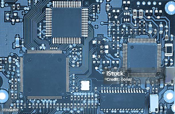 Closeup Of An Electronic Circuit Board Stock Photo - Download Image Now - Circuit Board, Abstract, Blue