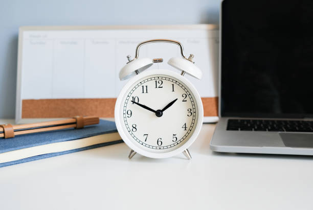 istock the clock with weekly planner and note book on the blue background represent time management and planner. 1724549794