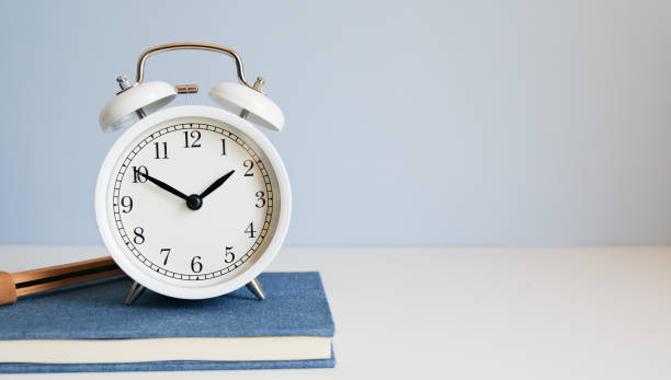 istock the white clock with weekly planner, notebook and laptop. Time management and plan for work and life balance. 1724550882