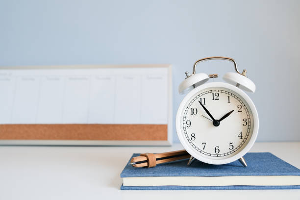 istock the clock with notebook and weekly planner on blue background for timing, time management and work life balance concept. 1724551391